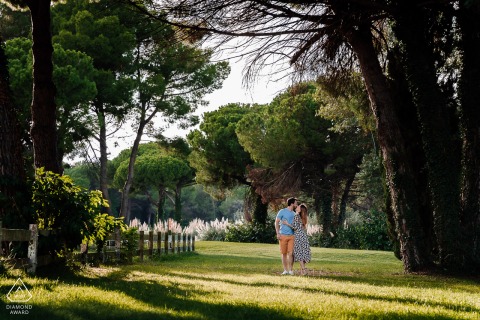France engagement Photo of a couple in Montpellier walking in the park in the afternoon