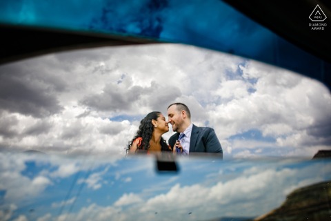 During the engagement portrait session in Cappadocia, Turkey, the couple posed nose to nose under a blue sky, with mirrors reflecting the beautiful clouds above.