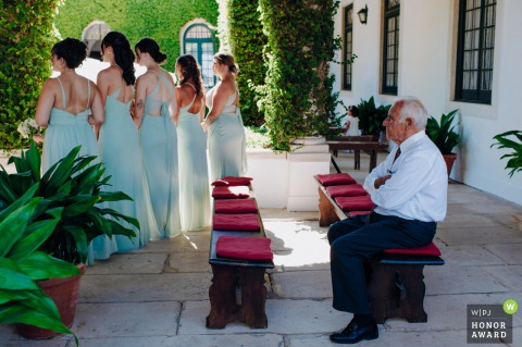 A picture from the civil ceremony, we can see the bridesmaid facing the couple, while a bored guest was seated waiting for the end of the ceremony at Quinta do Castilho, Vale de Figueira, Santarém, Portugal